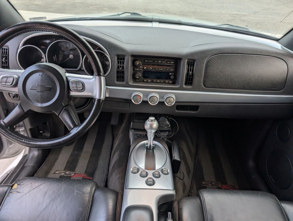 A cleaned dashboard, steering wheel and center console in a detailed vehicle