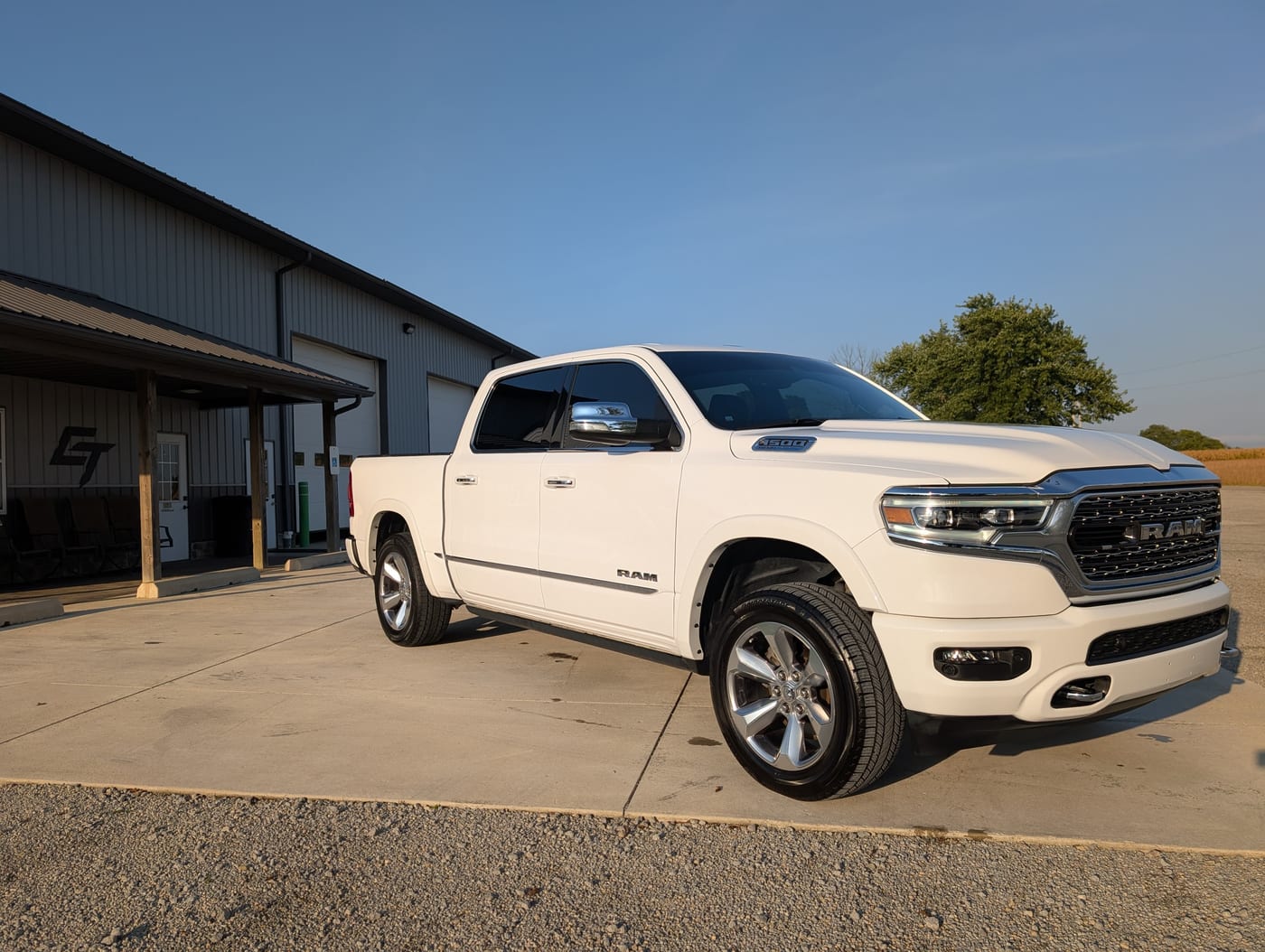 A ceramic coated white RAM 1500 Limited parked outside the Signature Auto Detailing shop building in Leesburg, Ohio